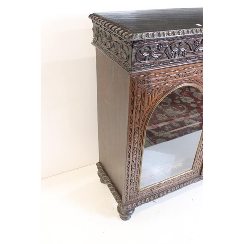 628 - Victorian Oak Display Cabinet with profuse carving, the two doors with domed glazed panels opening t... 