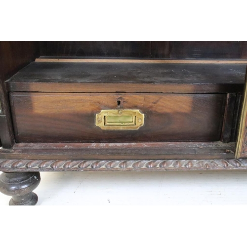 628 - Victorian Oak Display Cabinet with profuse carving, the two doors with domed glazed panels opening t... 