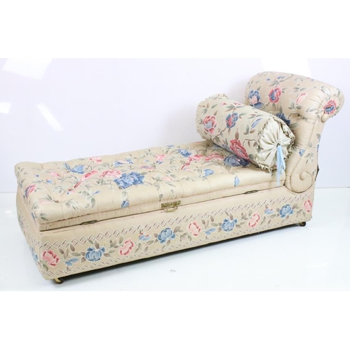 641 - Early 20th century Ottoman Daybed upholstered in cream floral fabric with bolster cushion, raised on... 