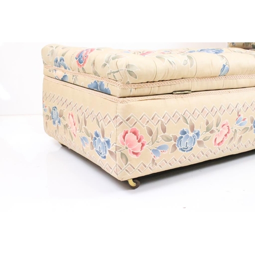 641 - Early 20th century Ottoman Daybed upholstered in cream floral fabric with bolster cushion, raised on... 