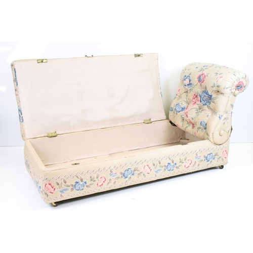 641 - Early 20th century Ottoman Daybed upholstered in cream floral fabric with bolster cushion, raised on... 