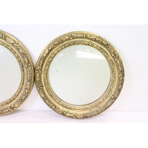 643 - Pair of 19th century Gilt Framed Circular Mirrors with acorn and oak leaf moulded frames, 68cm diame... 