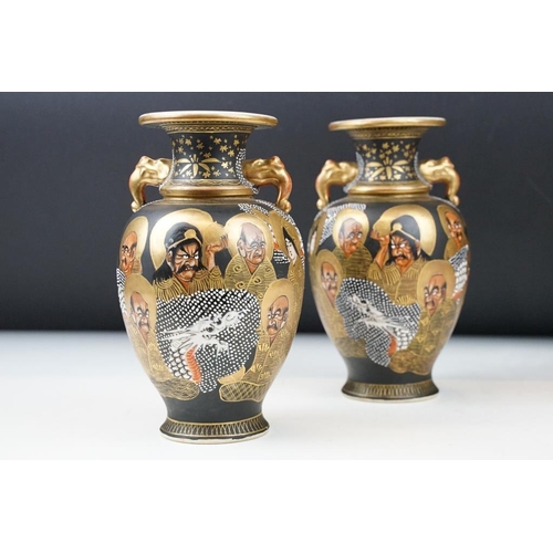 2 - Pair of early 20th century Japanese Satsuma ' Thousand Faces ' vases, of baluster form, twin-handed,... 