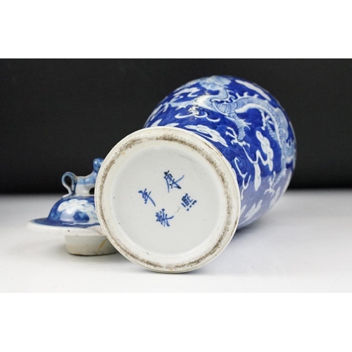 105 - Pair of Chinese blue & white baluster vases and covers, decorated with dragons chasing a flaming pea... 