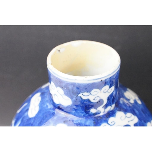 105 - Pair of Chinese blue & white baluster vases and covers, decorated with dragons chasing a flaming pea... 