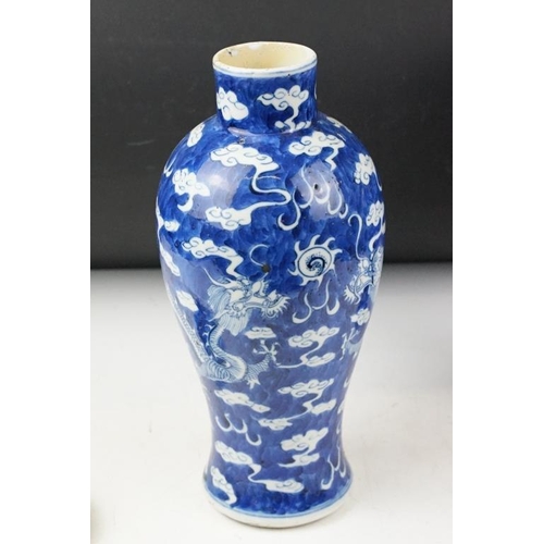 105 - Pair of Chinese blue & white baluster vases and covers, decorated with dragons chasing a flaming pea... 