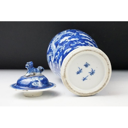 105 - Pair of Chinese blue & white baluster vases and covers, decorated with dragons chasing a flaming pea... 