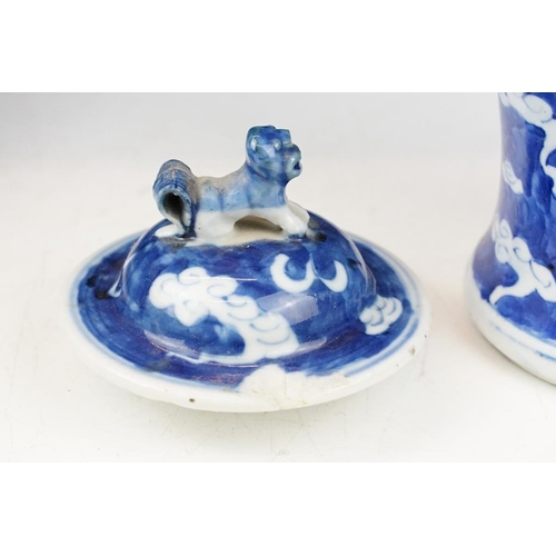 105 - Pair of Chinese blue & white baluster vases and covers, decorated with dragons chasing a flaming pea... 