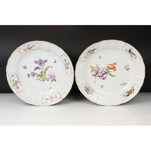 36 - Two 18th Century Meissen deep circular dishes with central floral sprays, the moulded borders with f... 