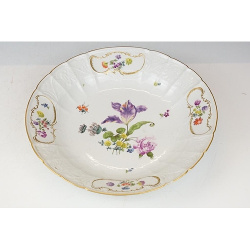 36 - Two 18th Century Meissen deep circular dishes with central floral sprays, the moulded borders with f... 