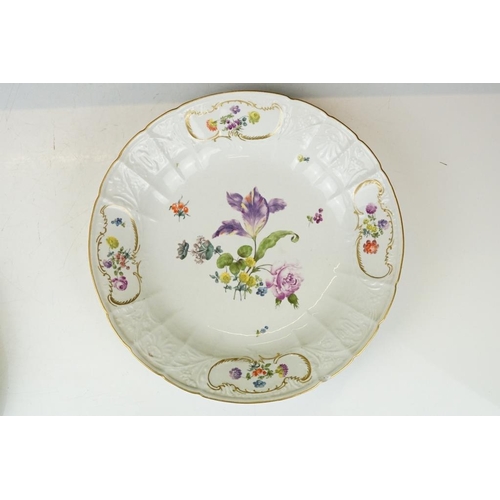 36 - Two 18th Century Meissen deep circular dishes with central floral sprays, the moulded borders with f... 