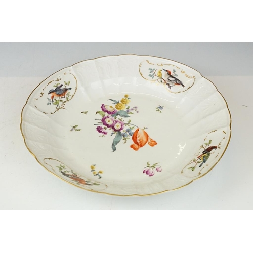 36 - Two 18th Century Meissen deep circular dishes with central floral sprays, the moulded borders with f... 