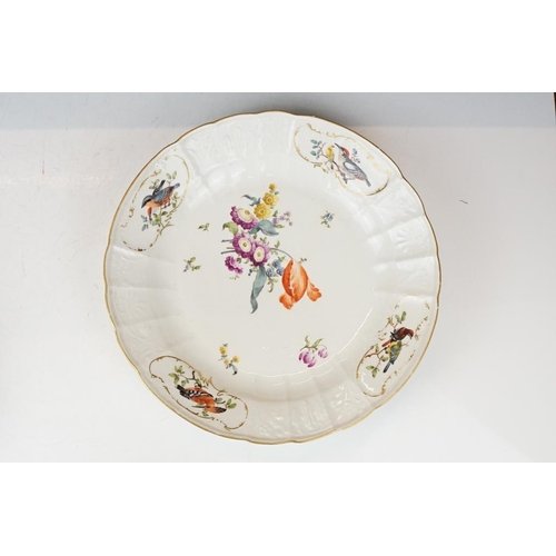 36 - Two 18th Century Meissen deep circular dishes with central floral sprays, the moulded borders with f... 