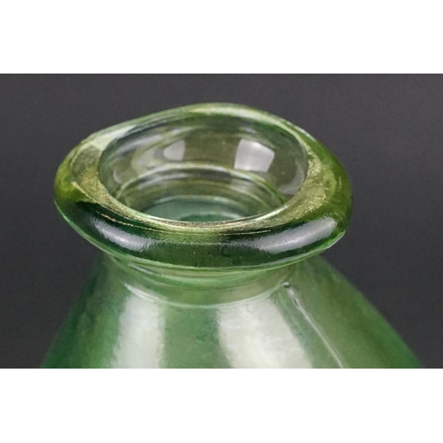 37 - Three green glass bottles / carboys to include a pair of bulbous form (with stoppers) and a further ... 