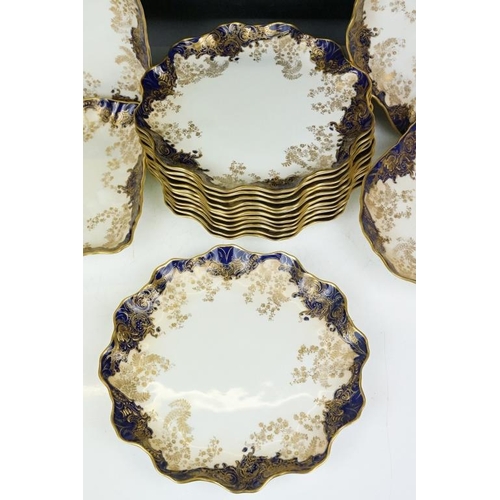 53 - Royal Doulton dessert service with gilt foliate decoration & cobalt blue borders, to include 12 dess... 