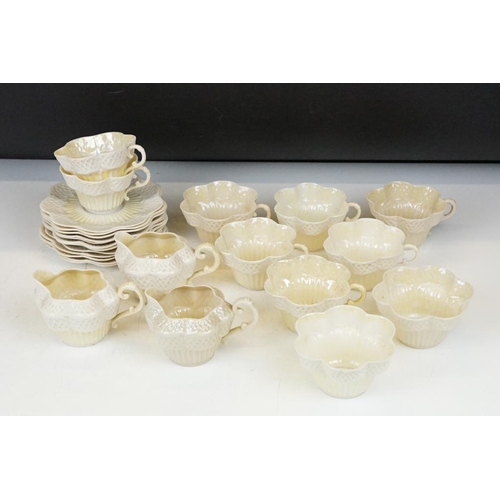 54 - Belleek Cream Cob Lustre tea ware, first and second period, to include 8 cups, 12 saucers, 3 milk ju... 