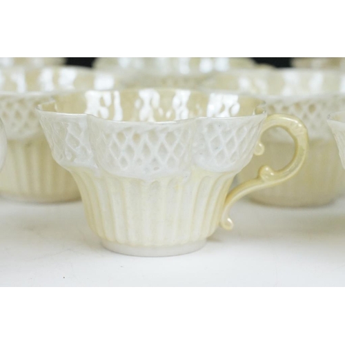 54 - Belleek Cream Cob Lustre tea ware, first and second period, to include 8 cups, 12 saucers, 3 milk ju... 