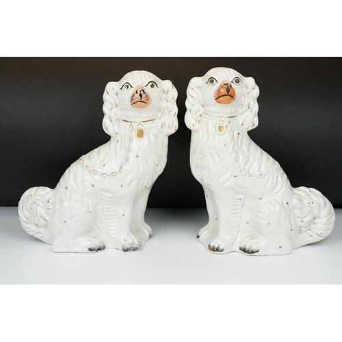 59 - Three pairs of Staffordshire ceramic dog figures, to include a pair of vases with gilt details (appr... 