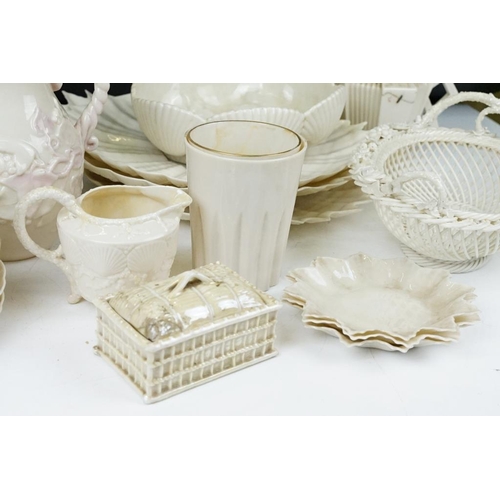 65 - Collection of Belleek moulded cream ceramics, 1st & 2nd period, to include a reticulated basket, 31 ... 