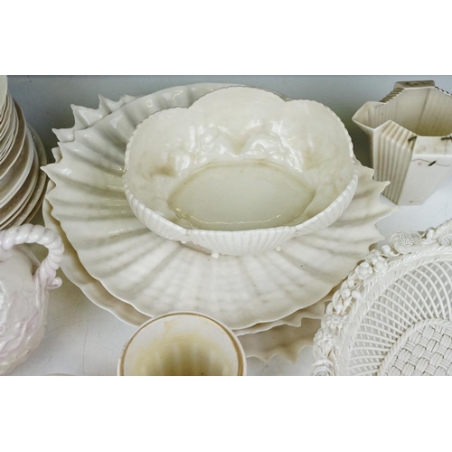 65 - Collection of Belleek moulded cream ceramics, 1st & 2nd period, to include a reticulated basket, 31 ... 