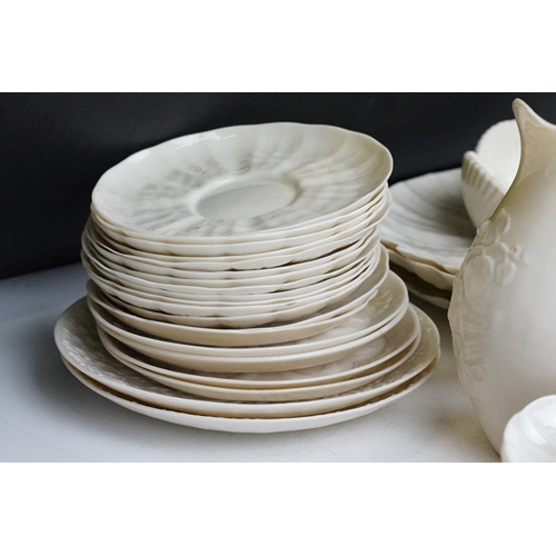 65 - Collection of Belleek moulded cream ceramics, 1st & 2nd period, to include a reticulated basket, 31 ... 