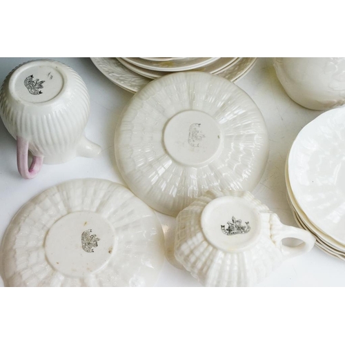 65 - Collection of Belleek moulded cream ceramics, 1st & 2nd period, to include a reticulated basket, 31 ... 