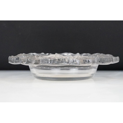 74 - Lalique 'Honfleur' pattern moulded glass circular dish, the border moulded with frosted leaves, sign... 