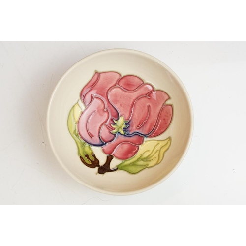 82 - Moorcroft Magnolia pattern bowl and paperweight, on cream ground. (Bowl approx 12cm diameter, impres... 