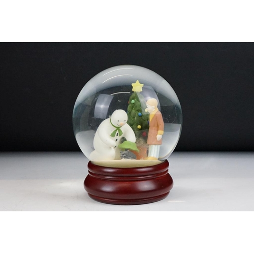 92 - Two boxed Coalport Characters ' The Snowman ' snow globes, to include First Edition Christmas Friend... 