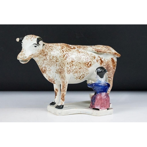 94 - Three Rye Pottery animal figures to include 'Champion' pig (11cm high), Cow and Bull; plus a similar... 