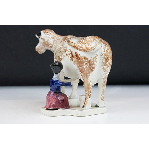 94 - Three Rye Pottery animal figures to include 'Champion' pig (11cm high), Cow and Bull; plus a similar... 