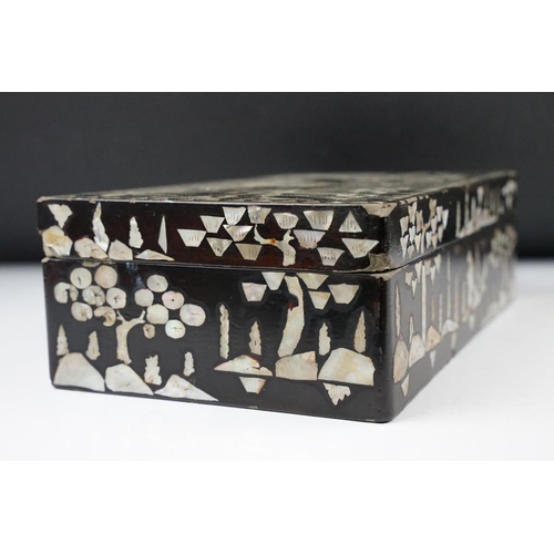 174 - Japanese black lacquer box with mother of pearl inlaid decoration, depicting a male figure mounted o... 