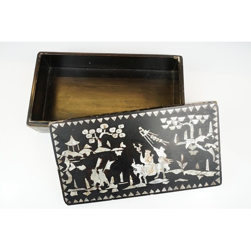 174 - Japanese black lacquer box with mother of pearl inlaid decoration, depicting a male figure mounted o... 