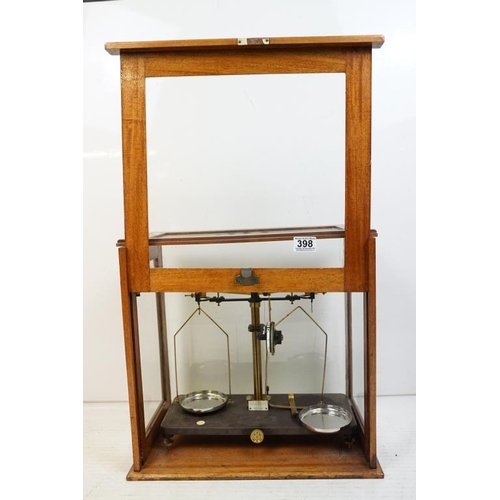 398 - Set of 20th Century Griffin & Tatlock brass balance scales, housed within a glazed wooden case. Appr... 