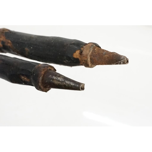 163 - Pair of African wooden tribal spears, with leather handholds and engraved decoration to metal tips, ... 