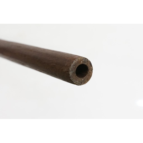 164 - Early 20th century wooden blow pipe / dart gun of tapering form, approx 163cm long