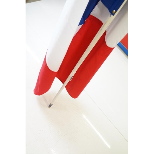 165 - Two large flags on poles to include a vintage Union Jack cloth flag and a French tricolour example. ... 