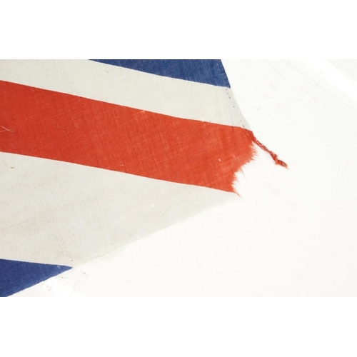 165 - Two large flags on poles to include a vintage Union Jack cloth flag and a French tricolour example. ... 