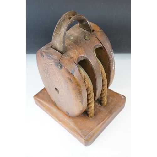 167 - Oak ships pulley block with twin rollers, raised on a rectangular base, approx 34cm high