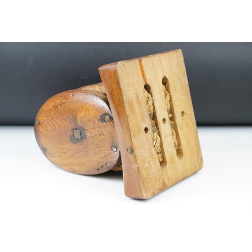 167 - Oak ships pulley block with twin rollers, raised on a rectangular base, approx 34cm high