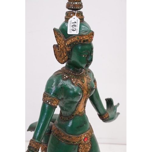 169 - Green lacquered & gilt wooden sculpture of a kneeling Thai Buddhai, with jewel effect decoration, ra... 