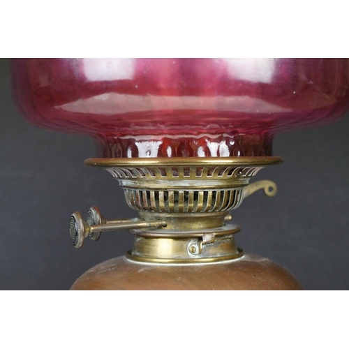 172 - Late 19th / early 20th century brass & copper oil lamp with ruby glass shade and copper font, raised... 