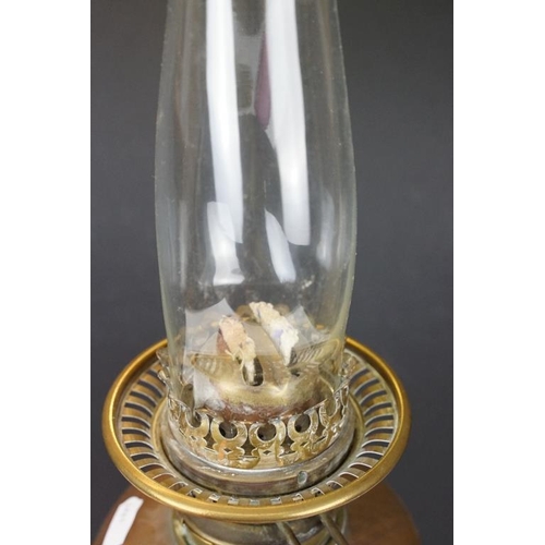 172 - Late 19th / early 20th century brass & copper oil lamp with ruby glass shade and copper font, raised... 