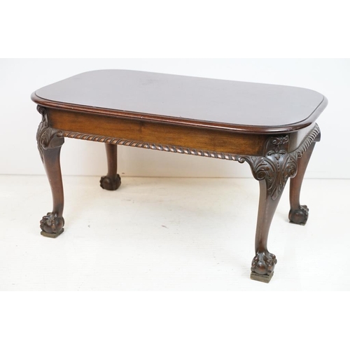 553 - Early 20th century Mahogany Low Table with curved ends, raised on carved cabriole legs with ball and... 