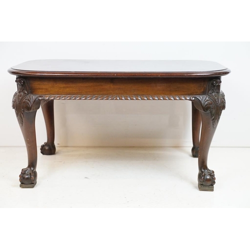 553 - Early 20th century Mahogany Low Table with curved ends, raised on carved cabriole legs with ball and... 