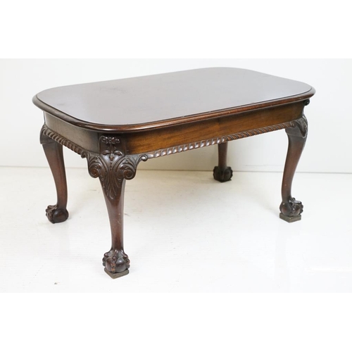 553 - Early 20th century Mahogany Low Table with curved ends, raised on carved cabriole legs with ball and... 