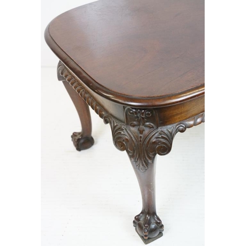 553 - Early 20th century Mahogany Low Table with curved ends, raised on carved cabriole legs with ball and... 