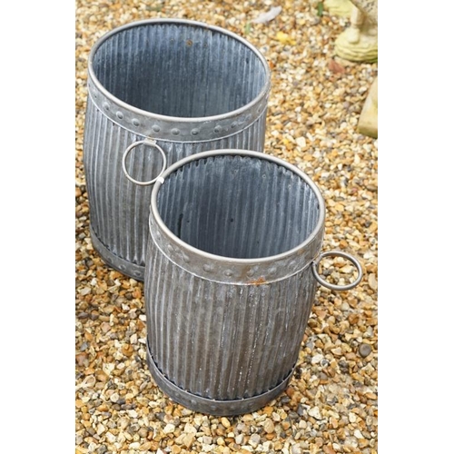 540 - Two galvanised metal planters of ribbed form, twin-handled (largest approx 49cm high), together with... 