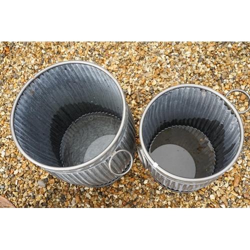 540 - Two galvanised metal planters of ribbed form, twin-handled (largest approx 49cm high), together with... 