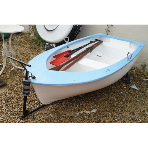 542A - Fibreglass rowing boat in pale blue, with white hull, two sets of oars, three life jackets and road ... 